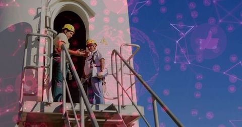 Technicians Collaborating on Wind Turbine Maintenance with Networking Overlay