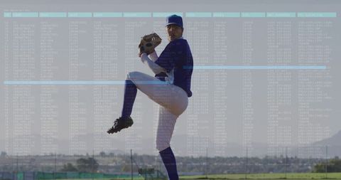Baseball Pitcher in Mid-Throw on Mound During Game