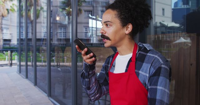 Male Restaurant Worker Using Smartphone for Voice Message - Download Free Stock Images Pikwizard.com