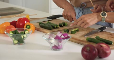 Partners Preparing Fresh Vegetables in Modern Kitchen