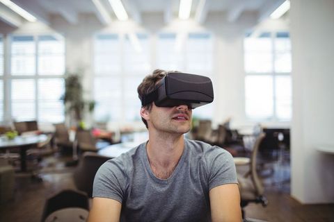 Man Experiencing Virtual Reality Modern Office