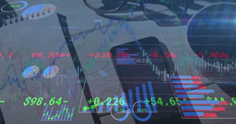 Financial data analytics on desk with smartphone and notebook