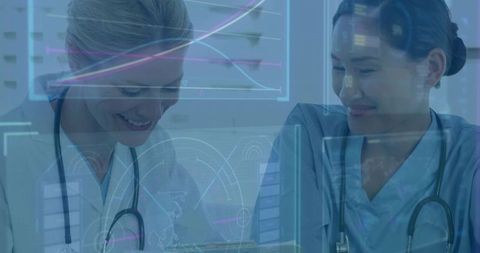 Clinicians Reviewing Tablet with Futuristic HUD Data Overlay for Medical Teamwork