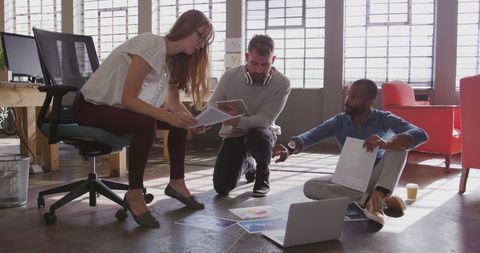 Diverse Team Brainstorming Collaboratively in Modern Office