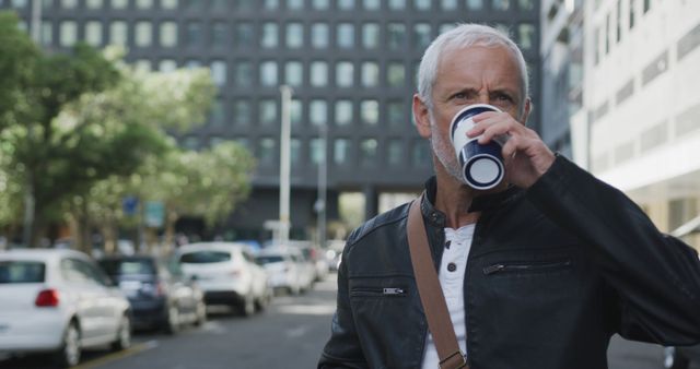 Mature Man Drinking Coffee Wearing Leather Jacket in Urban Area - Download Free Stock Images Pikwizard.com