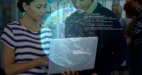 Colleagues collaborating on laptop with holographic globe overlay and code visualization