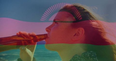 Woman enjoying drink on sunny beach with flag overlay