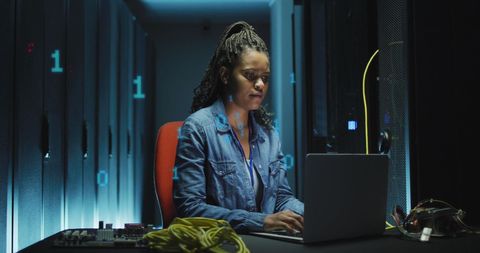 Female IT Engineer Managing Servers with Data Overlay in Modern Lab - Download Free Stock Images Pikwizard.com