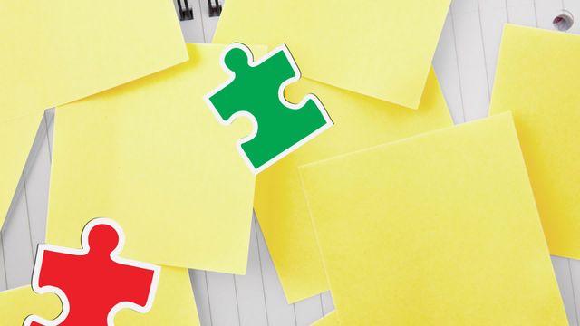 This vibrant illustration features puzzle pieces in green and red falling over yellow sticky notes, symbolizing autism awareness. The combination of office supplies and puzzle pieces evokes themes of organization, learning, and conscientiousness. Ideal for use in autism awareness campaigns, educational materials, and organizational tools promotions.