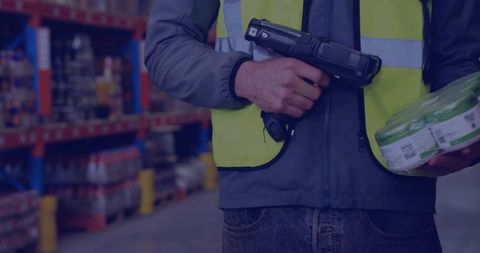 Warehouse worker scanning inventory with barcode scanner