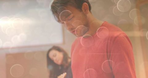 Focused man writing in bright office environment with creative vibes