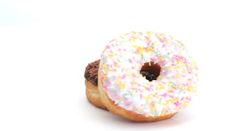 Donuts with Colorful Sprinkles on White Background