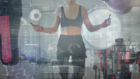 Female Boxer Training with Digital Data Interface in Gym
