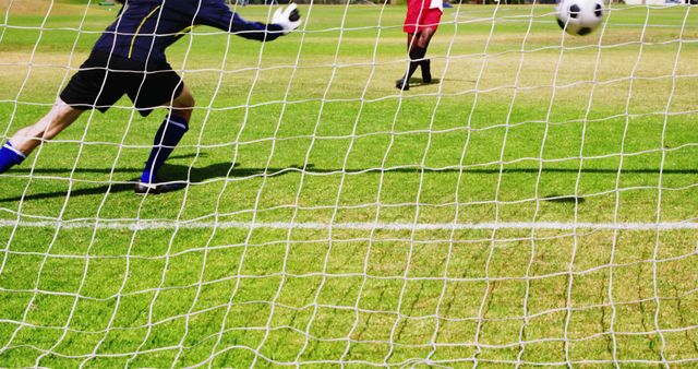 Goalie Making Save During Soccer Match on Green Field - Download Free Stock Images Pikwizard.com