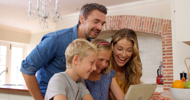 Happy Family Using Digital Tablet in Kitchen - Download Free Stock Images Pikwizard.com