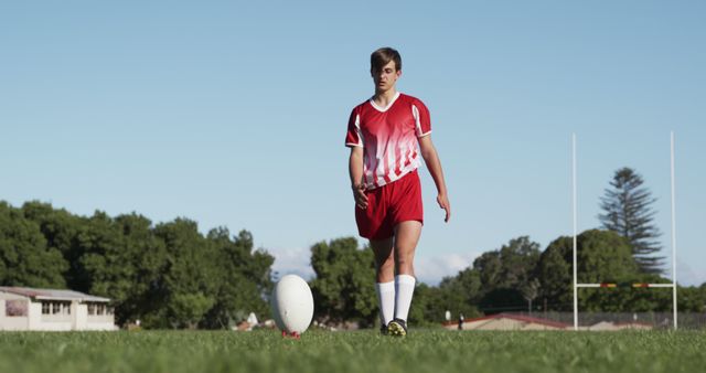 Teen Rugby Player Focusing on Ball in Field - Download Free Stock Images Pikwizard.com