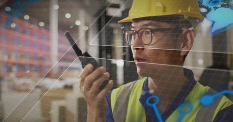 Korean Warehouse Supervisor Communicating via Walkie-Talkie with Augmented Reality Overlay