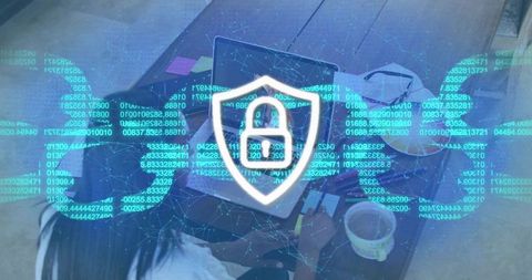 Women collaborating on laptop with cybersecurity shield overlay and encryption code