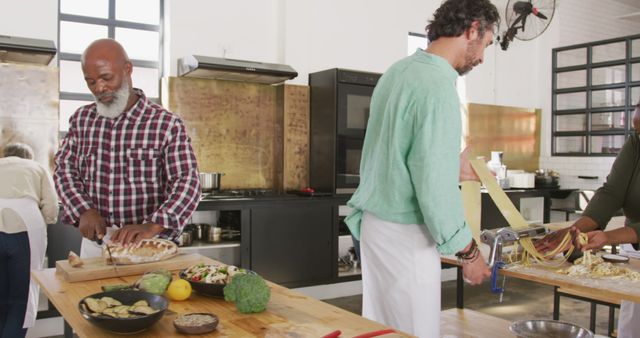 Senior and Younger Men Cooking Together in Modern Kitchen - Download Free Stock Images Pikwizard.com