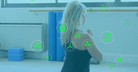 Woman Meditating Surrounded by Renewable Energy Icons