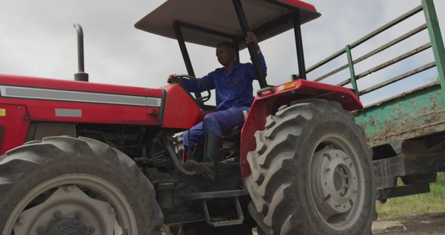 Farmer Driving Red Tractor in Agricultural Field - Download Free Stock Images Pikwizard.com