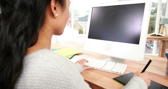 Woman Working at Home Office Desk on Computer with Stylus Pen - Download Free Stock Images Pikwizard.com