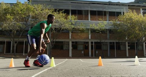 Athlete practicing basketball dribbling skills outdoors