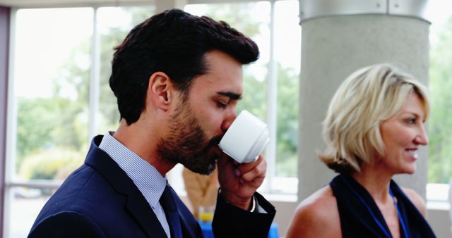 Businessman Drinking Coffee During Break in Office - Download Free Stock Images Pikwizard.com