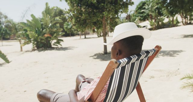 Man Relaxing on Lounge Chair with Straw Hat Under Sun - Download Free Stock Images Pikwizard.com