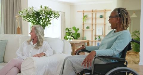 Senior Friends Enjoying Conversation in Cozy Living Room