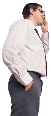 Smiling Businessman Holding Phone in Hand and Standing