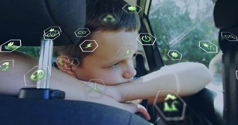 Child in car surrounded by sustainable energy icons symbolizing future conservation