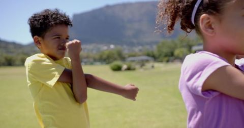Children Engaging in Playful Activities in Scenic Park