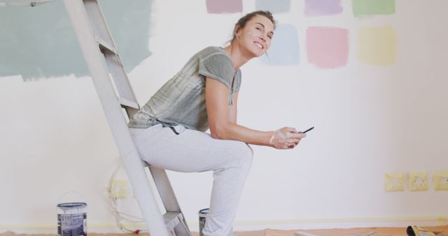 Woman Taking a Break While Painting Room - Download Free Stock Images Pikwizard.com