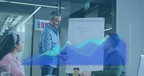 Business Team Analyzing Data Visualization on Graphs