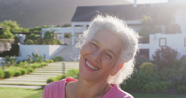 Smiling Senior Woman Relaxing in Lush Outdoor Environment - Download Free Stock Images Pikwizard.com