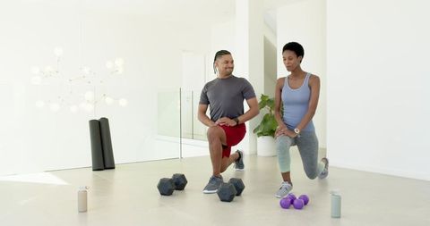 Fit Duo Embracing Fitness Routine with Weights at Home