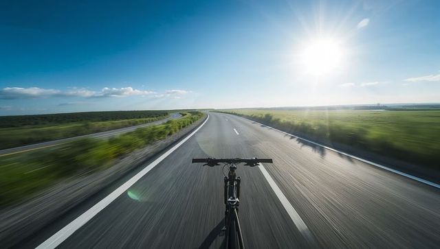Solo Ride Down Serene Country Highway at Sunrise