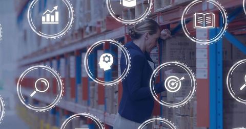 Warehouse Supervisor Inspecting Inventory and Scanning Barcodes with Analytics Overlay