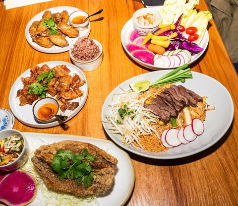 Variety of Homemade Asian Dishes on Wooden Table