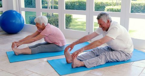 Senior Couple Enjoying Stretching Exercises Indoors - Download Free Stock Images Pikwizard.com