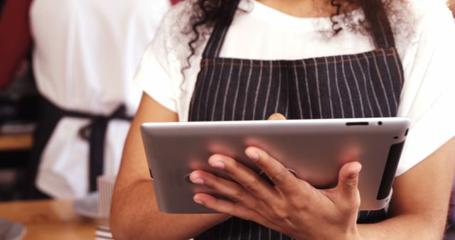 Barista Holding Tablet in Coffee Shop - Download Free Stock Images Pikwizard.com