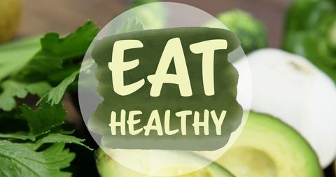 Eat Healthy Message on Fresh Kiwi and Greens Background
