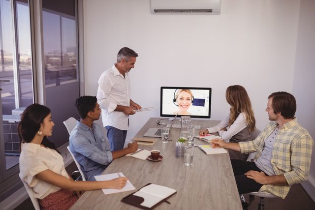 Team Engaged in Video Conference in Modern Office - Download Free Stock Photos Pikwizard.com