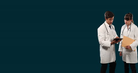 Medical Professionals Analyzing Digital Chart on Tablet