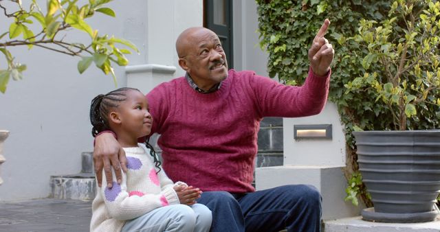 Grandfather Bonding with Granddaughter in Garden - Download Free Stock Images Pikwizard.com