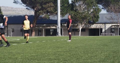 Team in Training Focusing on Soccer Skills on Sunny Day