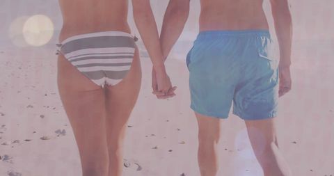 Romantic Caucasian Couple Holding Hands on Sunny Beach - Download Free Stock Images Pikwizard.com