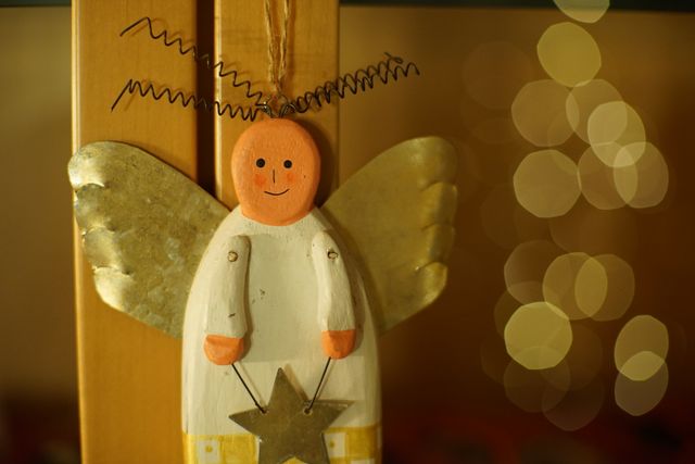 Handcrafted Wooden Angel Christmas Ornament with Golden Wings - Download Free Stock Photos Pikwizard.com