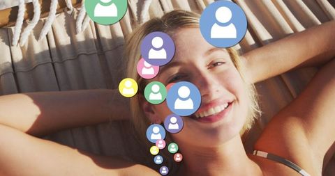 Smiling Woman on Beach Hammock Amid Social Media Icons